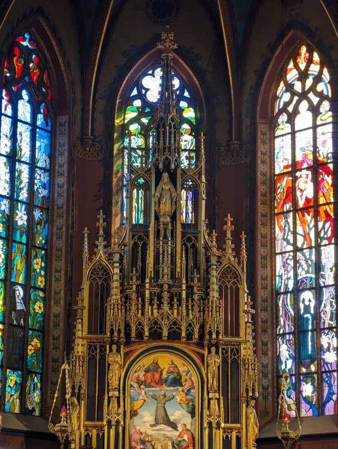 Gothic altar and stained glass in Krakow's Old Town